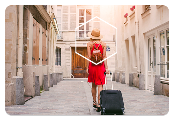 Woman traveling with backpack and suitcase